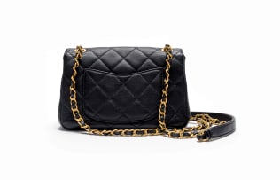 Chanel; A Limited Edition Black Lambskin Paris Monaco Mini Flap Bag in with Antique Gold-Tone Hardware
