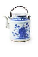 A Chinese teapot, late 19th century and a blue and white dish, 18th century, depicting Guanyin in the hall of the hundred children