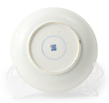 A Chinese teapot, late 19th century and a blue and white dish, 18th century, depicting Guanyin in the hall of the hundred children