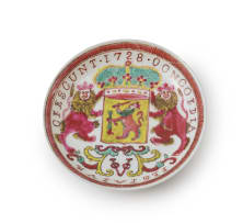 A Chinese famille rose porcelain cup and saucer bearing the arms of the Dutch East India Company, Yongzheng period, dated 1728