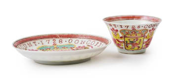A Chinese famille rose porcelain cup and saucer bearing the arms of the Dutch East India Company, Yongzheng period, dated 1728