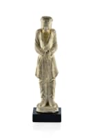 An early Chinese pottery figure of a tomb attendant, T'ang dynasty, 618 - 906