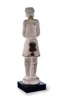 An early Chinese pottery figure of a tomb attendant, T'ang dynasty, 618 - 906