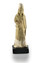 A Chinese pottery tomb figure of a tomb attendant, T'ang dynasty, 618 - 906