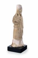 A Chinese pottery tomb figure of a tomb attendant, T'ang dynasty, 618 - 906