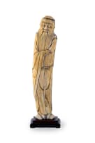 A Chinese ivory tusk carving depicting the Daoist Immortal Zhongli Quan on wooden base, 17th century
