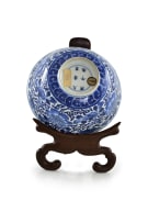 A pair of Chinese blue and white porcelain rice bowls on rosewood stands, Kangxi period, 1662-1722