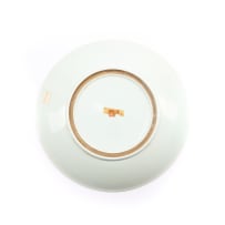 A Chinese blue and white porcelain plate, decorated with floral roundels and scrolling foliage