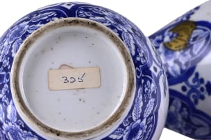 A pair of Chinese blue and white porcelain slender-necked bottles, Kangxi period, 1662-1722