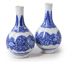 A pair of Chinese blue and white porcelain bottle-shaped vases, Kangxi period, 1662-1772