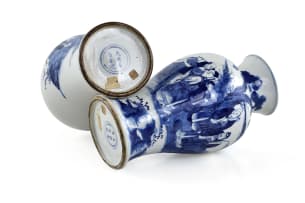 A pair of Chinese blue and white porcelain vases, painted with figures in a landscape, bearing a Chenghua mark, 18th or 19th century