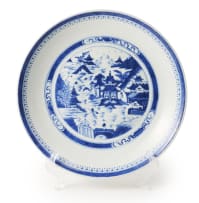 A pair of Chinese blue and white porcelain plates painted with a mountain landscape scene, 19th century, two