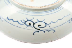 A Chinese blue and white porcelain plate, decorated with cranes in a landscape setting
