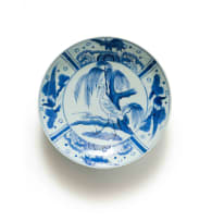 A Chinese blue and white porcelain plate, decorated with cranes in a landscape setting