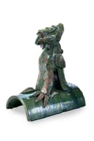 A Chinese ceramic ridge tile modelled as a stylised phoenix, Ming/Qing dynasty, 1368–1912