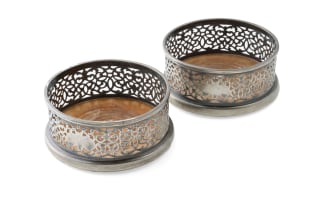 A pair of silver-plated wine coasters, 19th century