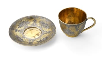 A Russian silver gilt enamel cup and saucer, maker's mark 'A.T', c.1850