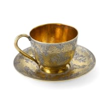 A Russian silver gilt enamel cup and saucer, maker's mark 'A.T', c.1850