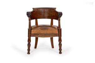 Empire style mahogany and leather armchair with carved lion heads, 19th century