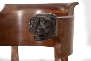 Empire style mahogany and leather armchair with carved lion heads, 19th century