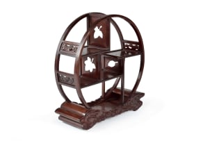 Chinese rosewood 'moon gate' display stand, 20th century