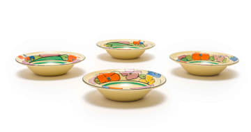 Clarice Cliff; Four Clarice Cliff 'Bizarre' hand-painted bowls with floral and tree border