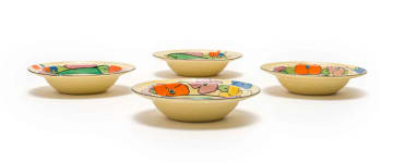 Clarice Cliff; Four Clarice Cliff 'Bizarre' hand-painted bowls with floral and tree border
