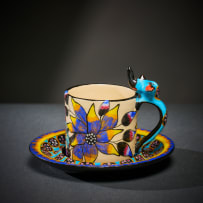 Ardmore Ceramic Studio; Set of eight animal espresso cups and saucers