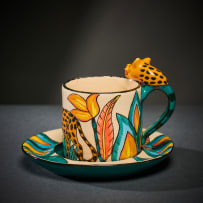 Ardmore Ceramic Studio; Set of eight animal espresso cups and saucers