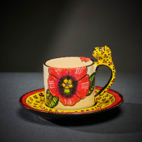 Ardmore Ceramic Studio; Set of eight animal espresso cups and saucers