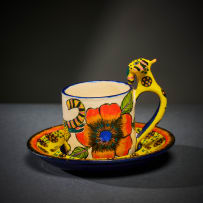 Ardmore Ceramic Studio; Set of eight animal espresso cups and saucers