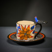 Ardmore Ceramic Studio; Set of eight animal espresso cups and saucers