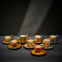 Ardmore Ceramic Studio; Set of eight animal espresso cups and saucers