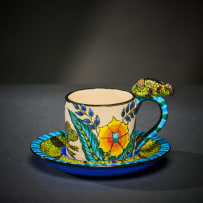 Ardmore Ceramic Studio; Set of six animal espresso cups and saucers