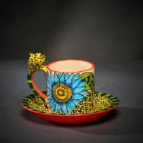 Ardmore Ceramic Studio; Set of six animal espresso cups and saucers