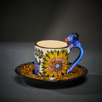Ardmore Ceramic Studio; Set of six animal espresso cups and saucers