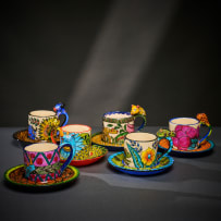 Ardmore Ceramic Studio; Set of six animal espresso cups and saucers