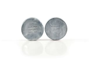 René Lalique; Two René Lalique 'Fleurs d'Amour' aluminium powder compacts for Roger et Gallet, designed 1922