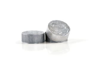 René Lalique; Two René Lalique 'Fleurs d'Amour' aluminium powder compacts for Roger et Gallet, designed 1922