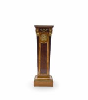 A pair of Empire style mahogany, birds-eye-maple and satinwood-veneered gilt-brass mounted pedestals, late 19th/early 20th century