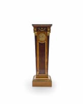 A pair of Empire style mahogany, birds-eye-maple and satinwood-veneered gilt-brass mounted pedestals, late 19th/early 20th century