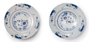 A pair of Delft bowls with flower and foliage motif, circa 18th century.