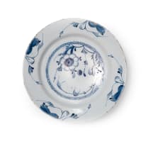 A pair of Delft bowls with flower and foliage motif, circa 18th century.
