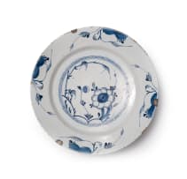 A pair of Delft bowls with flower and foliage motif, circa 18th century.