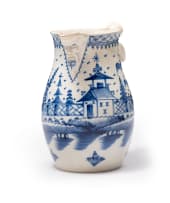 Pearlware blue and white mask jug, 18th century