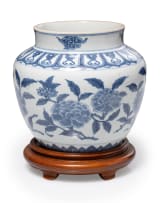 Porcelain blue and white floral ginger jar on wooden stand
