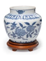 Porcelain blue and white floral ginger jar on wooden stand
