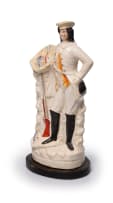 Staffordshire figure of a gamekeeper, circa 19th century