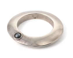 A silver bangle with hematite cabochon, unknown maker, 20th century