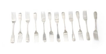 An assembled set of George III fiddle pattern Irish silver cake forks, James Le Bas, Dublin,1827; and various makers